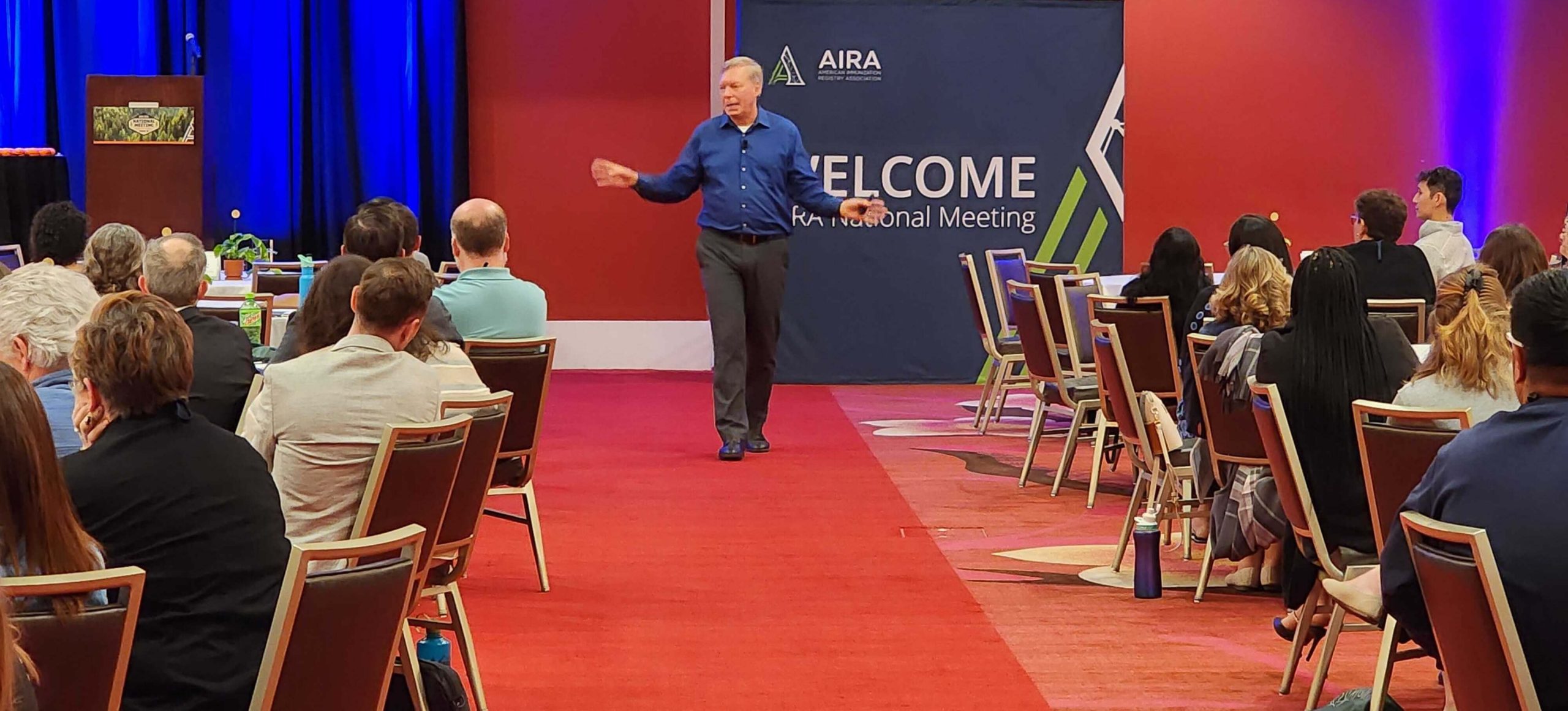 Scott Crabtree presenting to a large audience